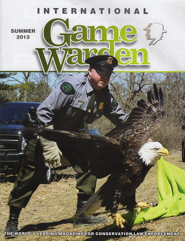 Issue of International Game Warden magazine with review of Badges, Bears, and Eagles by Steven T. Callan