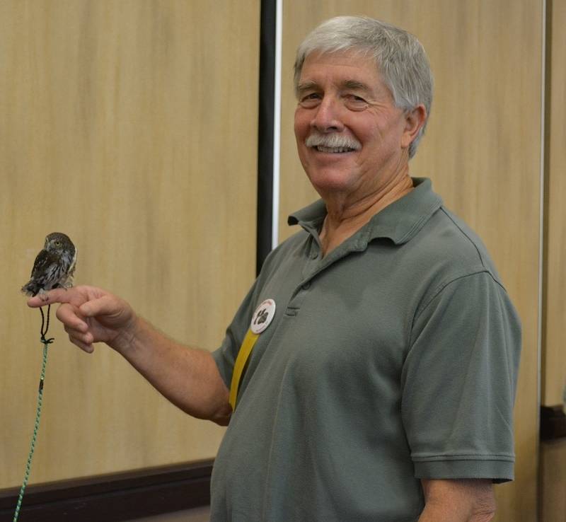 Author Steven T. Callan and Mr. Whoo-Dini, a northern pygmy owl, at the Pacific Flyway Decoy Association Wildfowl Art Festival