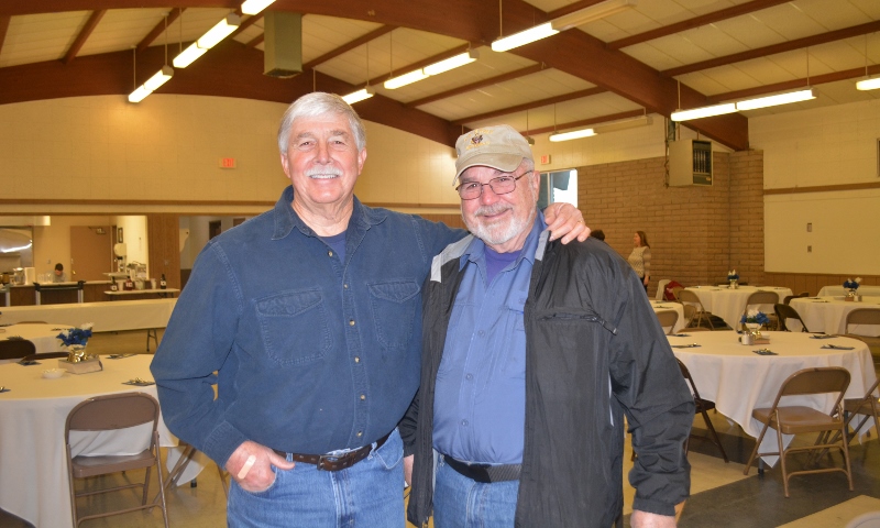 Author Steven T. Callan visits with Bill Davis at the Orland Alumni Association Awards Dinner.