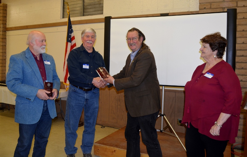 Authors John D. Nesbitt and Steven T. Callan each receiving the Orland Alumni Association "Alumnus of the Year" award from President Larry Donnelley and Claire Arano.