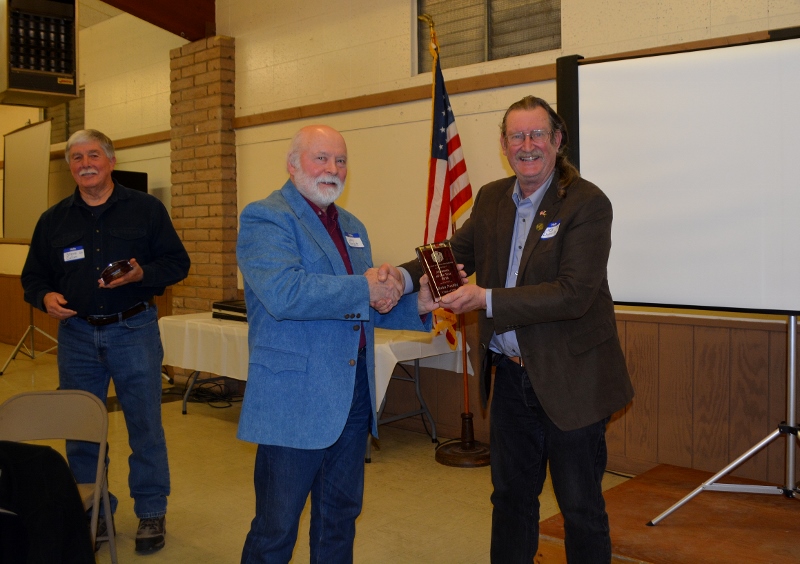 Authors Steven T. Callan and John D. Nesbitt each receiving the Orland Alumni Association "Alumnus of the Year" award from President Larry Donnelley.