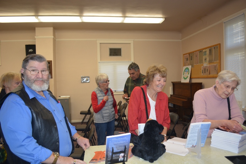 Visitors wait to have author Steven T. Callan sign copies of his books.