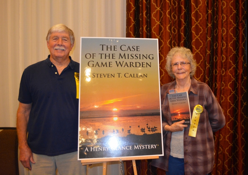 Author Steven T. Callan poses with friend at book signing for his award-winning novel ,The Case of the Missing Game Warden