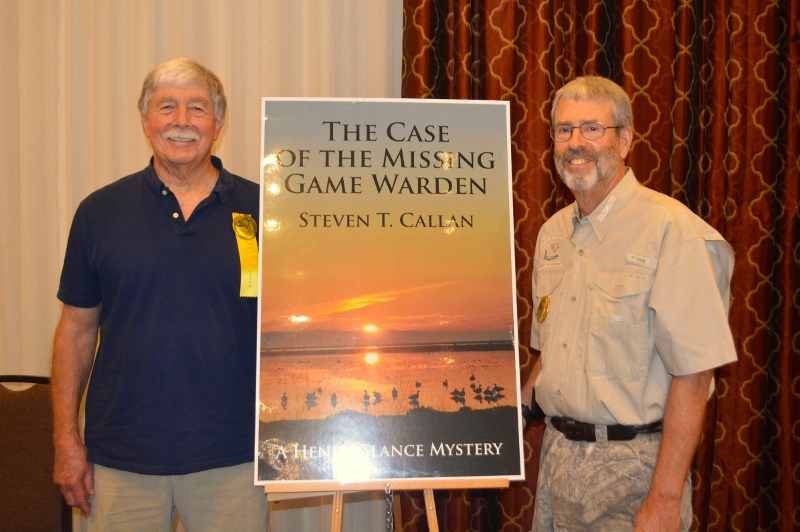 Author Steven T. Callan poses with friend at book signing for his award-winning novel ,The Case of the Missing Game Warden