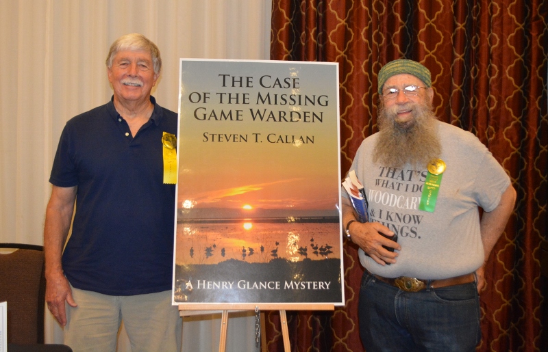 Author Steven T. Callan poses with friend at book signing for his award-winning novel ,The Case of the Missing Game Warden