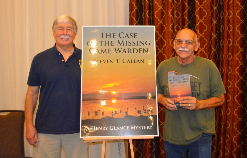 Author Steven T. Callan poses with friend at book signing for his award-winning novel ,The Case of the Missing Game Warden