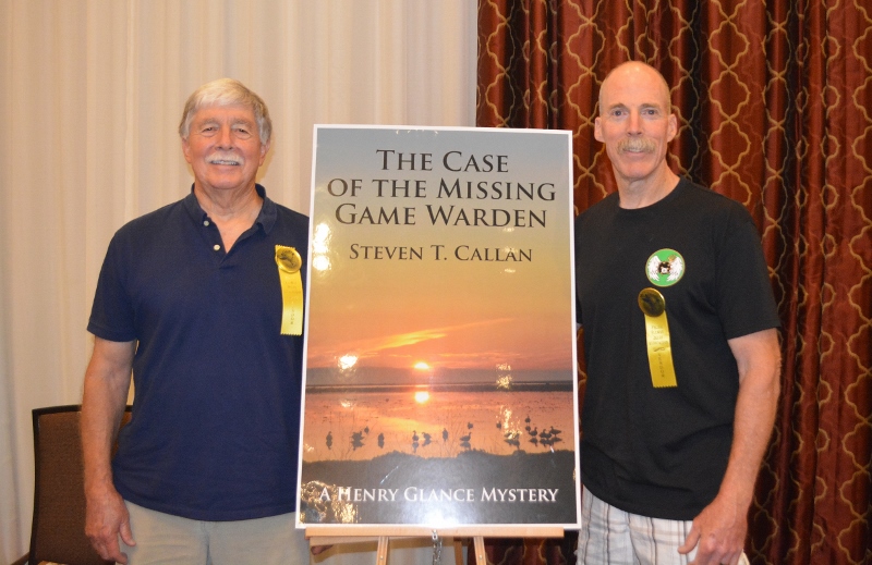 Author Steven T. Callan poses with friend at book signing for his award-winning novel ,The Case of the Missing Game Warden