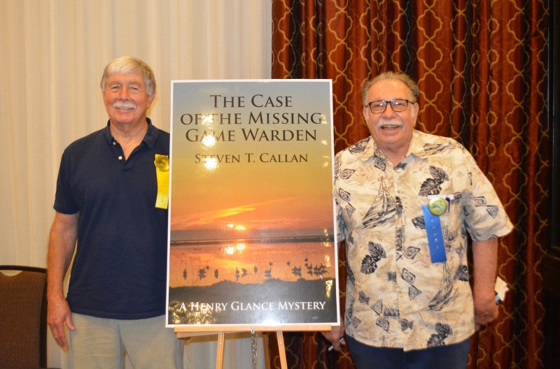 Author Steven T. Callan poses with friend at book signing for his award-winning novel ,The Case of the Missing Game Warden