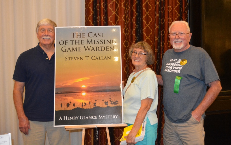 Author Steven T. Callan poses with friends at book signing for his award-winning novel ,The Case of the Missing Game Warden