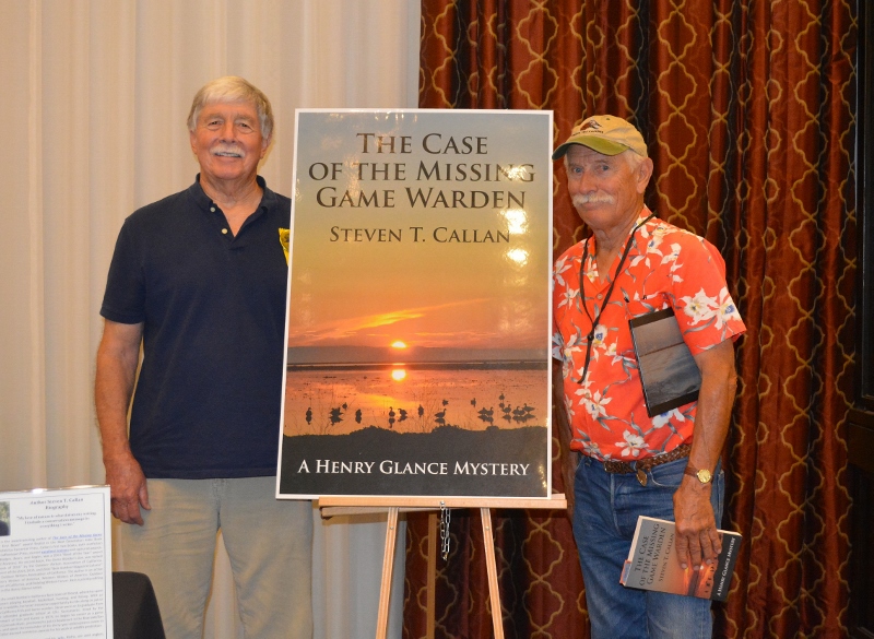 Author Steven T. Callan poses with friend at book signing for his award-winning novel ,The Case of the Missing Game Warden