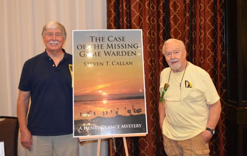 Author Steven T. Callan poses with friend at book signing for his award-winning novel ,The Case of the Missing Game Warden