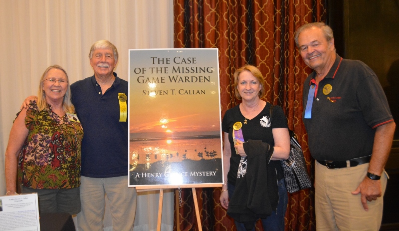 Author Steven T. Callan poses with friends at book signing for his award-winning novel ,The Case of the Missing Game Warden