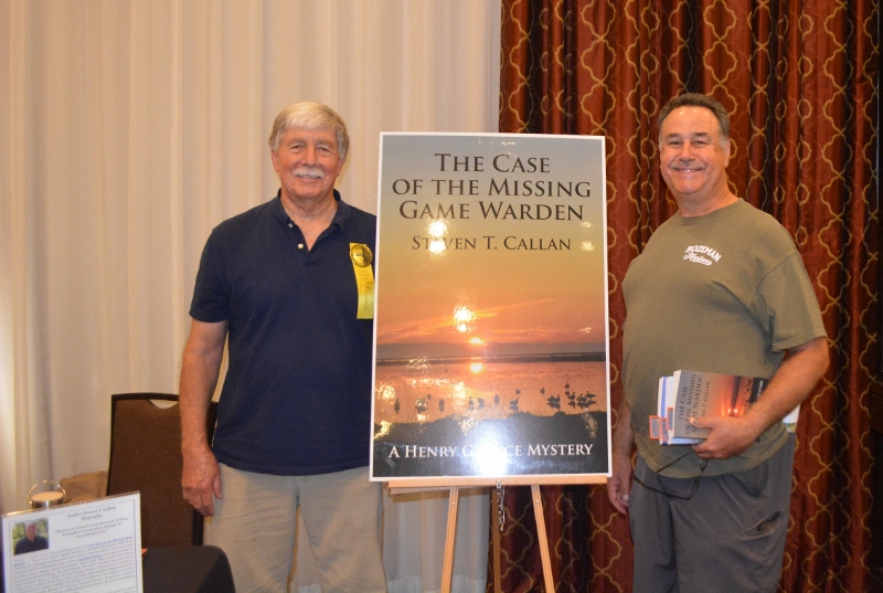 Author Steven T. Callan poses with friend at book signing for his award-winning novel ,The Case of the Missing Game Warden