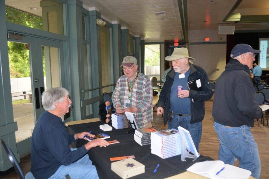 Author Steven T. Callan signs copies of his award-winning books at the May 2023 meeting of California Fly Fishers Unlimited in Sacramento