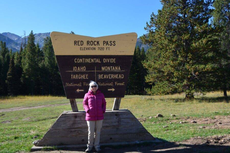 Author Steven T. Callan's wife, Kathy, stands at one of North America's continental divides, on the way to Yellowstone National Park