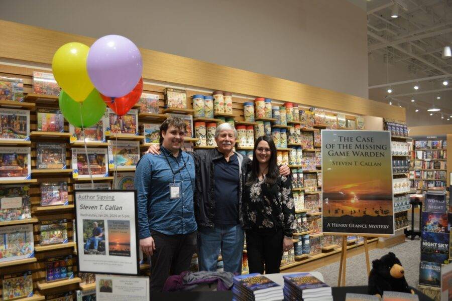 Chico Barnes and Noble Managers Judah Merrill (left) and Alisa Wrangham (right) help celebrate Author Steven T. Callan's (center) book signing at the grand opening of the Redding Barnes and Noble, January 24, 2024.